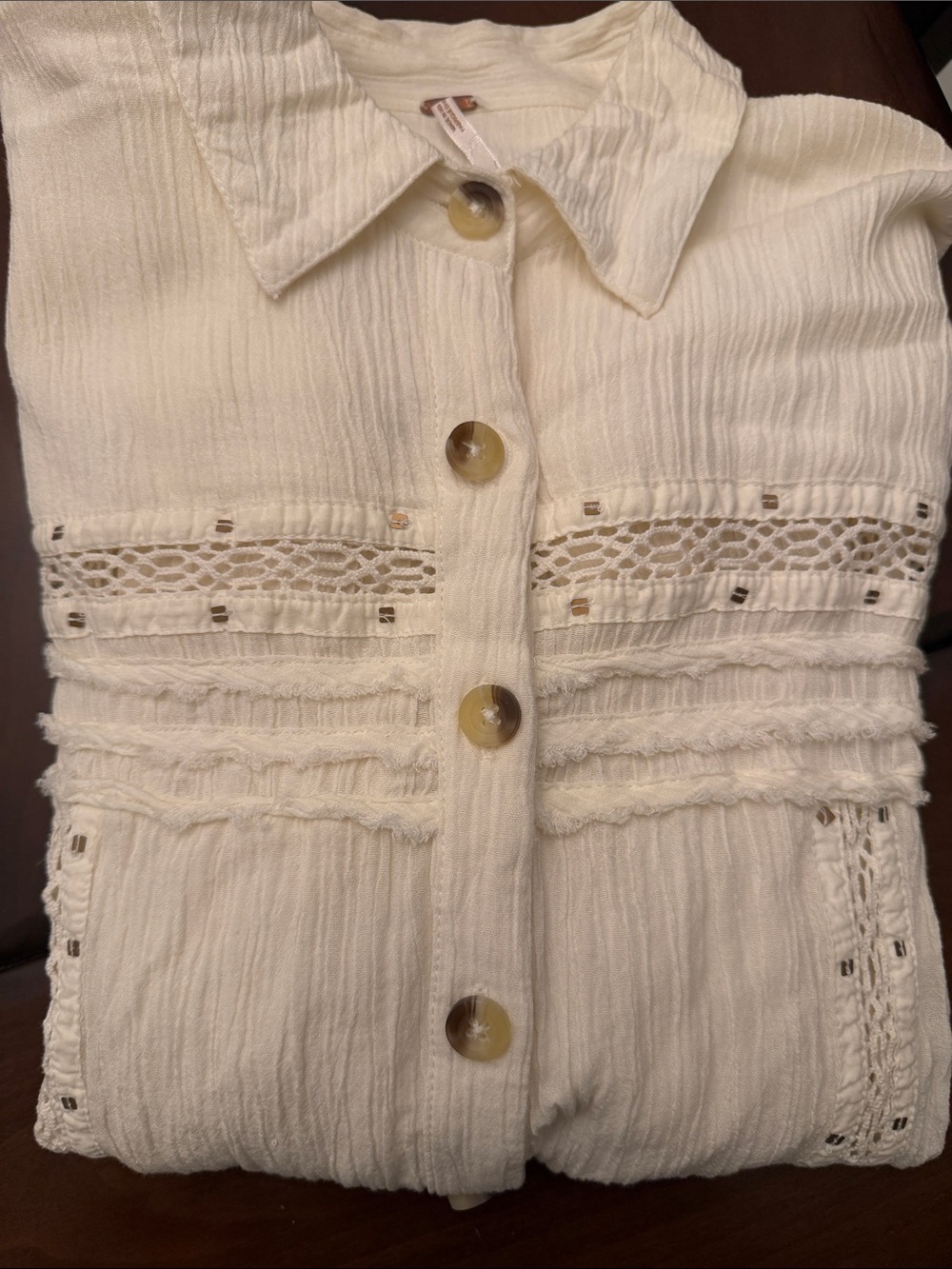 Label inside cream women's jacket